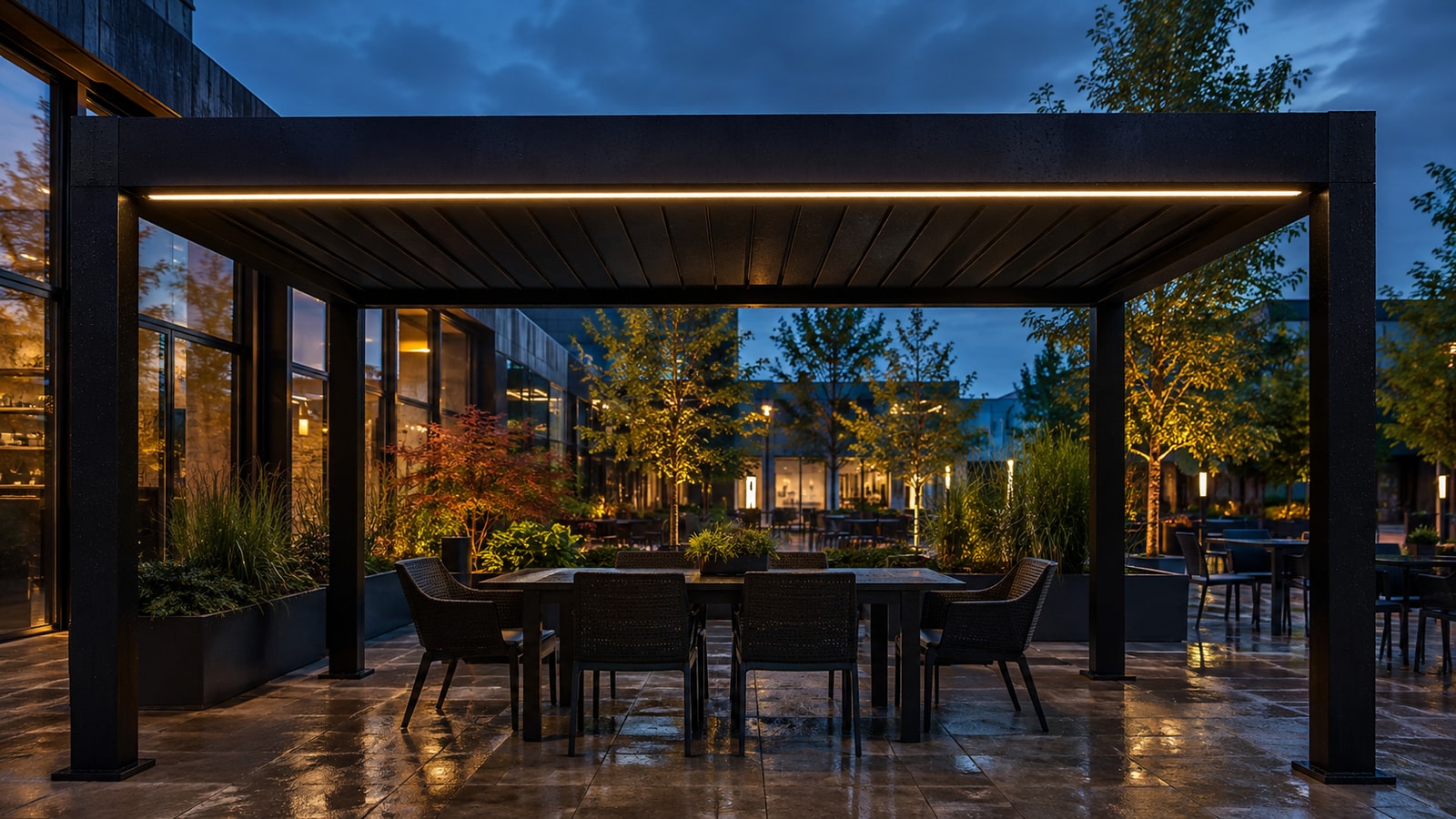 Continuous warm-white linear lighting beneath a rain-wet outdoor restaurant pergola